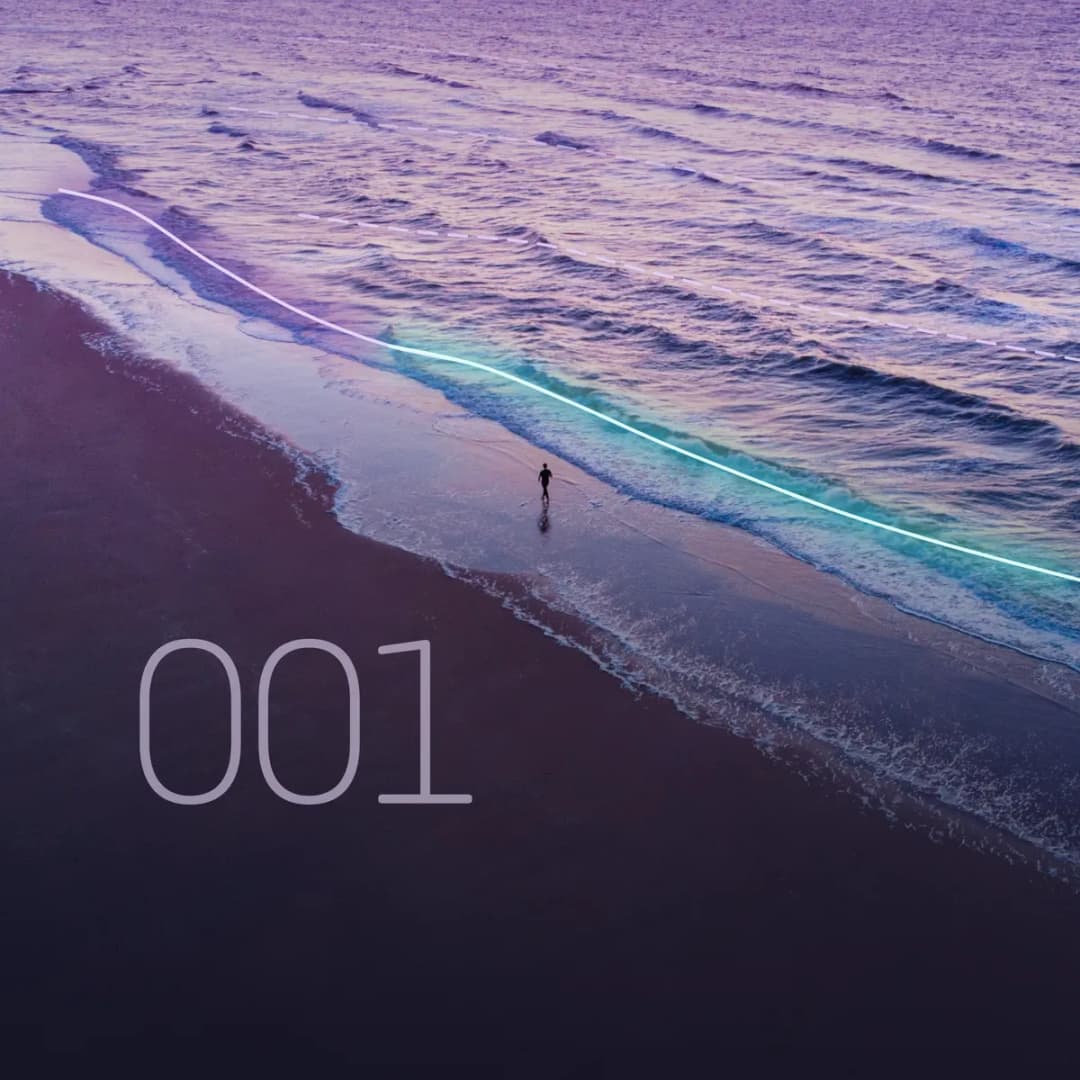 Changelog 001: aerial shoreline at dusk with the newest wave crest glowing