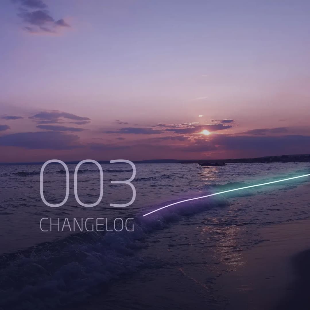 Changelog 003: a sunset coastline with the newest wave glowing purple to turquoise